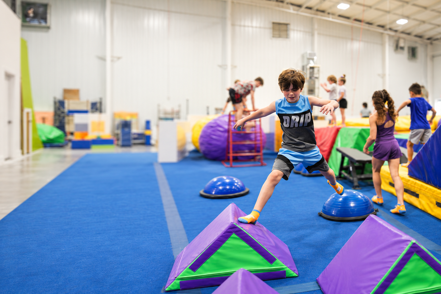Child stepping across colorful padded obstacles